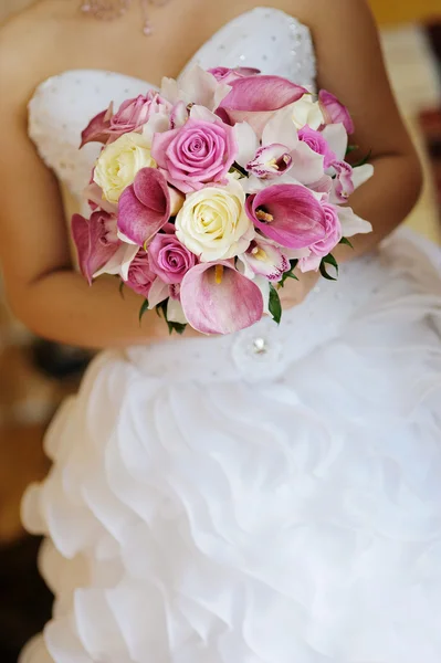 Bridal Bouquet in the bride hands Stock Image