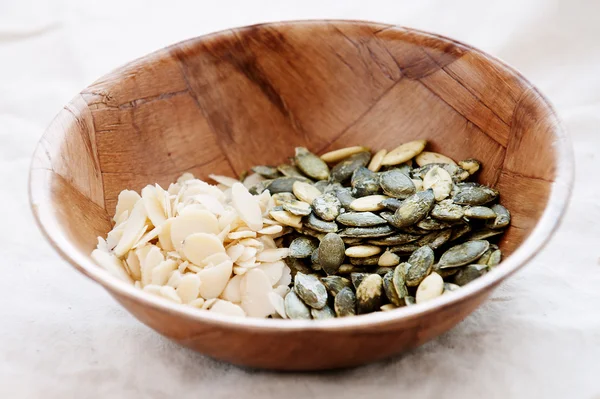 Flakes of almond and pumpkin seeds — Stock Photo, Image