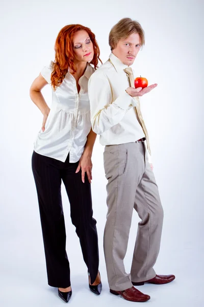 Man and woman with apple — Stock Photo, Image