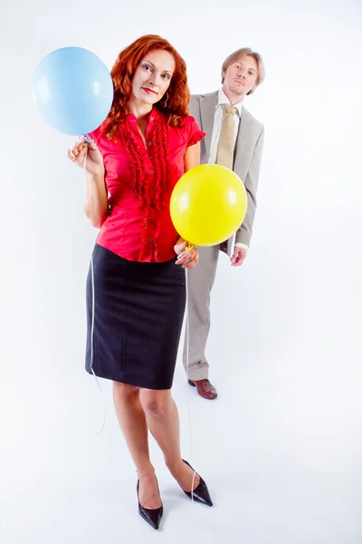 Business man and woman with air balloons — Stock Photo, Image