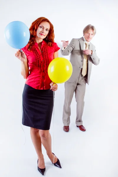 Business man and woman with air balloons — Stock Photo, Image