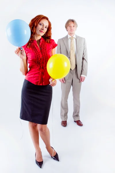 Business man and woman with air balloons — Stock Photo, Image