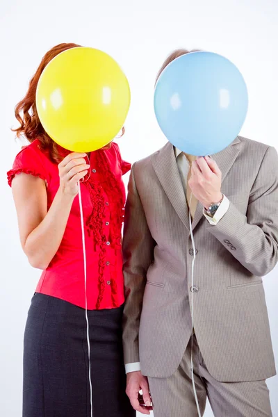 Business man and woman with air balloons — Stock Photo, Image