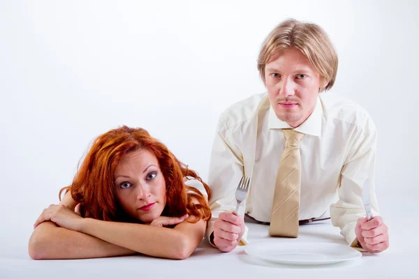 Women and man with blank plate — Stock Photo, Image