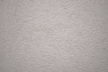 Beyaz alçılı duvarın arka planı. Yazı için yer var. Projeniz için kalite kalıbı