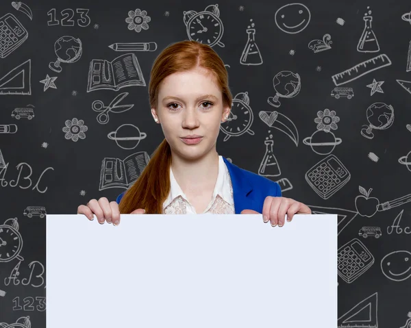 Teen girl holding a sign with copyspace for adverts — Stock Photo, Image