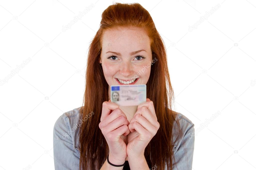 Young woman showing her driver's license