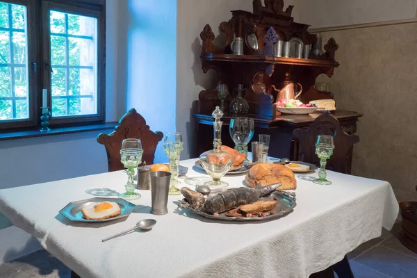 Reconstruction of the table with food. Old castle. The time of nobility and knighthood