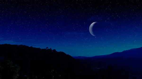 Moon and stars over mountain. Blue night sky panorama