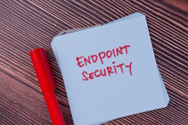 Endpoint Security write on sticky notes isolated on Wooden Table.