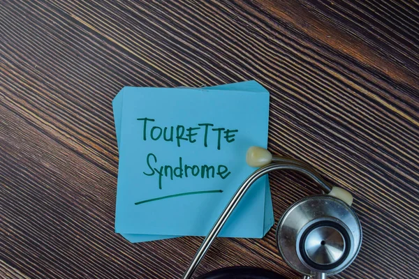 Tourette Syndrome Write Sticky Notes Isolated Wooden Table — Stockfoto