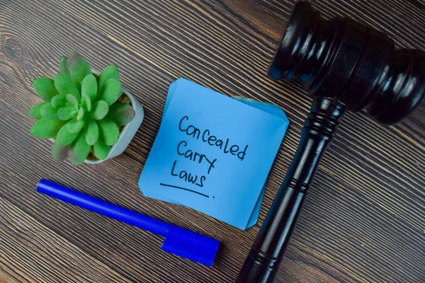 Concealed Carry Laws Write Sticky Notes Isolated Wooden Table — Stock fotografie
