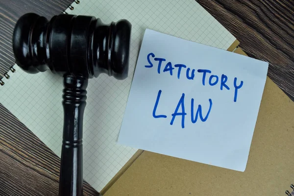 Concept Statutory Law Write Sticky Notes Gavel Isolated Wooden Table — ストック写真