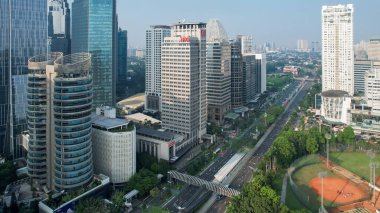 Aerial view of the new green urban landscape in the city. With noise cloud. Jakarta, Indonesia, Juni 23, 2022