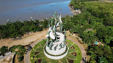 Aerial view of the A giant shark and crocodile statue as a symbol of the city of Surabaya. A landmark or monument as an icon of Surabaya city. East Java, Indonesia, August 28, 2022