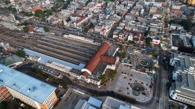 Aerial view of Jakarta Kota Train Station with Jakarta cityscape background. Jakarta, Indonesia, August 30, 2022
