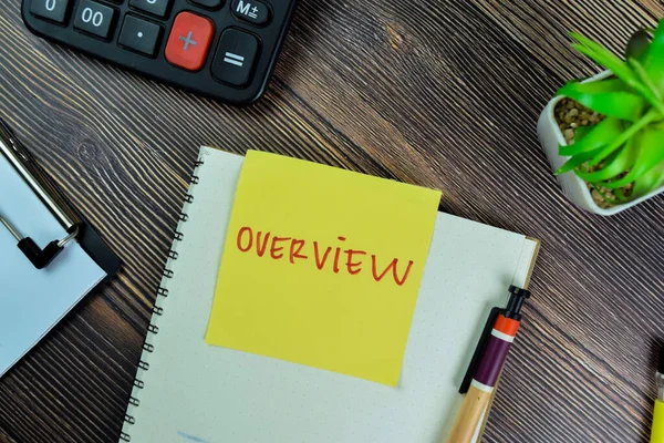 Concept of Overview write on sticky notes isolated on Wooden Table.