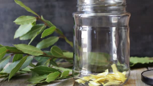 Laurel Liqueur Lemon Peels Woman Puts Lemon Peels Glass Jar — Vídeo de stock