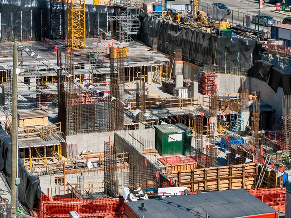 Foundation pit of high-rise building under constraction. Underground parkage construction.