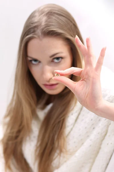 Young woman with a pill — Stock Photo, Image