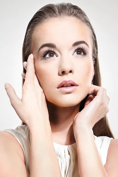 Face of the girl in a white dress on a white background — Stock Photo, Image