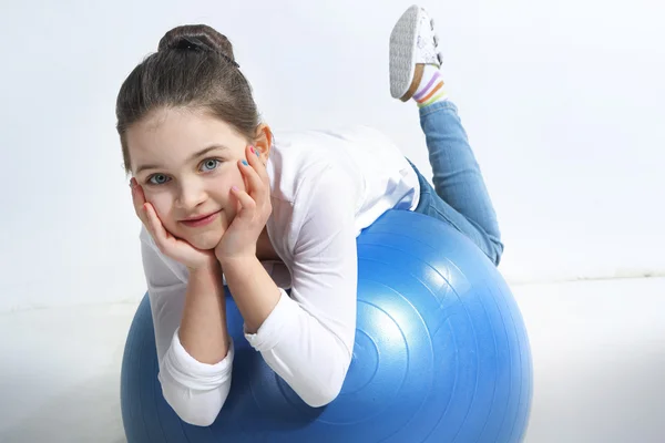 Little girl posing with a ball — Stock Photo, Image