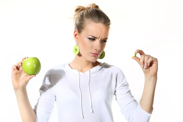 Girl with a green apple on a white background — Stock Photo, Image