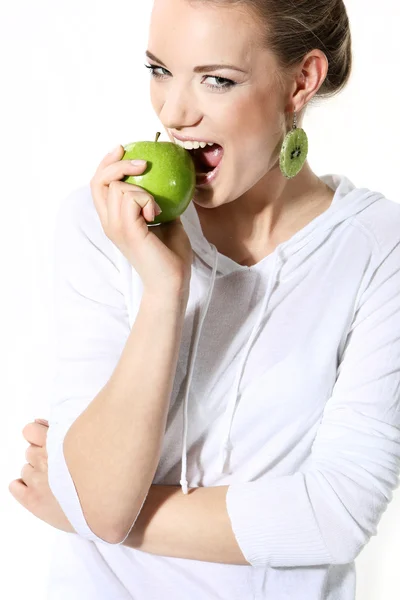 Girl with a green apple on a white background — Stock Photo, Image