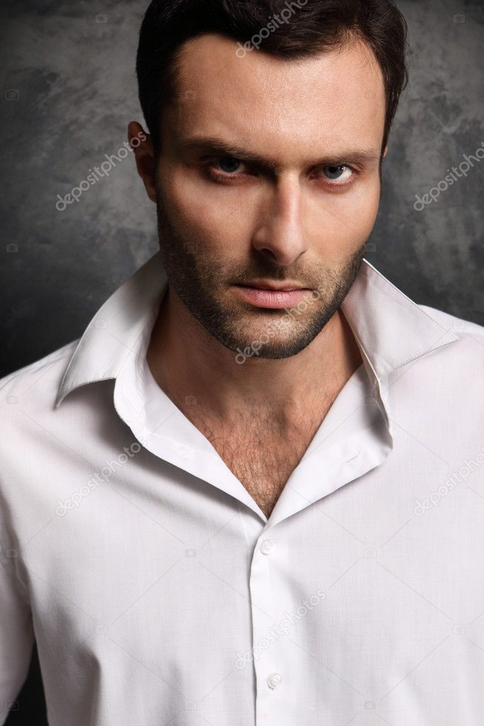 A man in a shirt on a black background