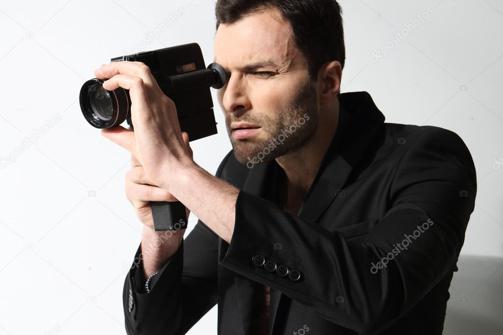 Attractive man taking photo