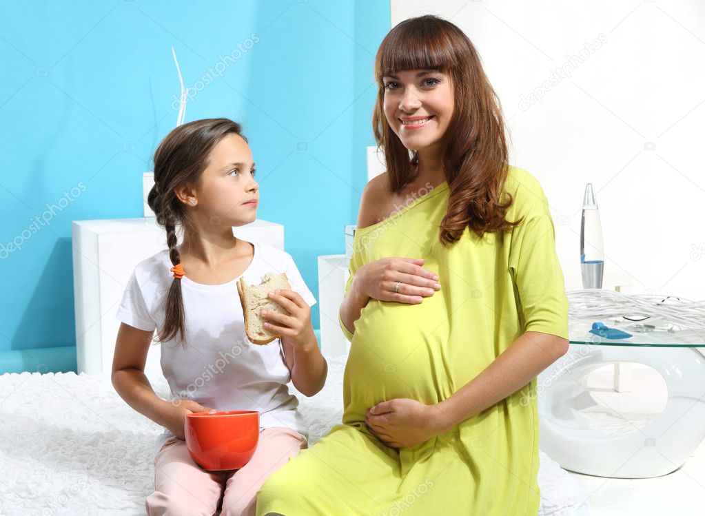 Pregnant woman with her daughter