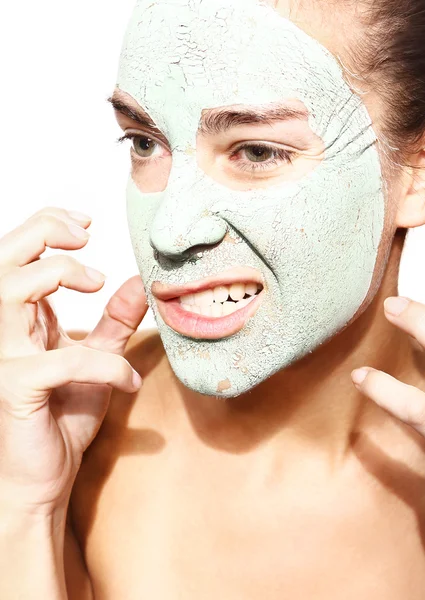 Evil woman in the mask with green clay — Stock Photo, Image