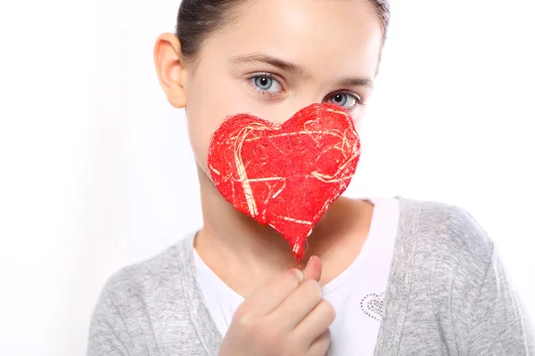 Portrait of a girl with red heart symbol — Stock Photo, Image