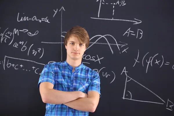 Student at the blackboard — Stock Photo, Image