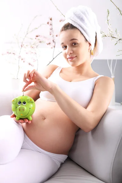 Pregnant with piggy bank — Stock Photo, Image