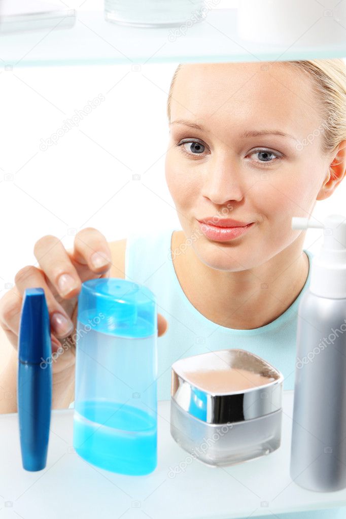 Woman buys liquid make-up remover.
