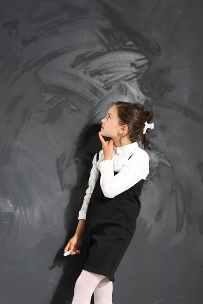 Schoolgirl at the blackboard — Stock Photo, Image