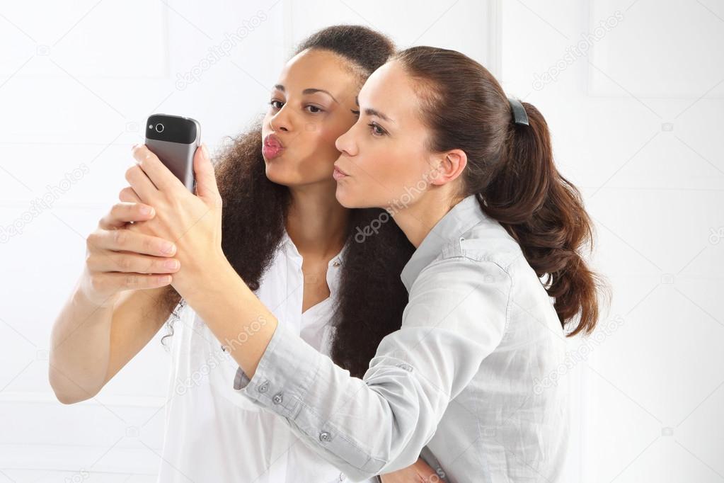 Two women with mobile phone
