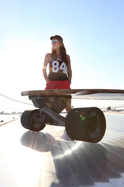 Skateboarding, fashion and style. Woman on a skateboard. — Stock Photo, Image