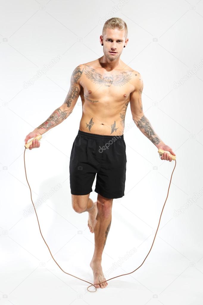 Jumping rope exercises with jump rope Stock Photo by ©robertprzybysz ...