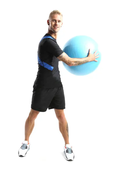 Gymnastics, man exercises on the ball — Stock Photo, Image