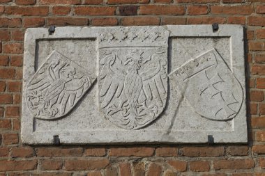The historic coat of arms on the building clipart