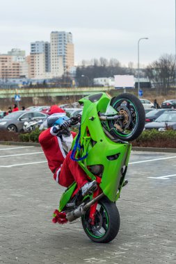 Santa on a motorcycls clipart