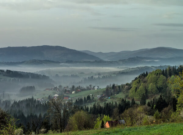 Fog in the Zywiec Beskids, Poland during the sunrise