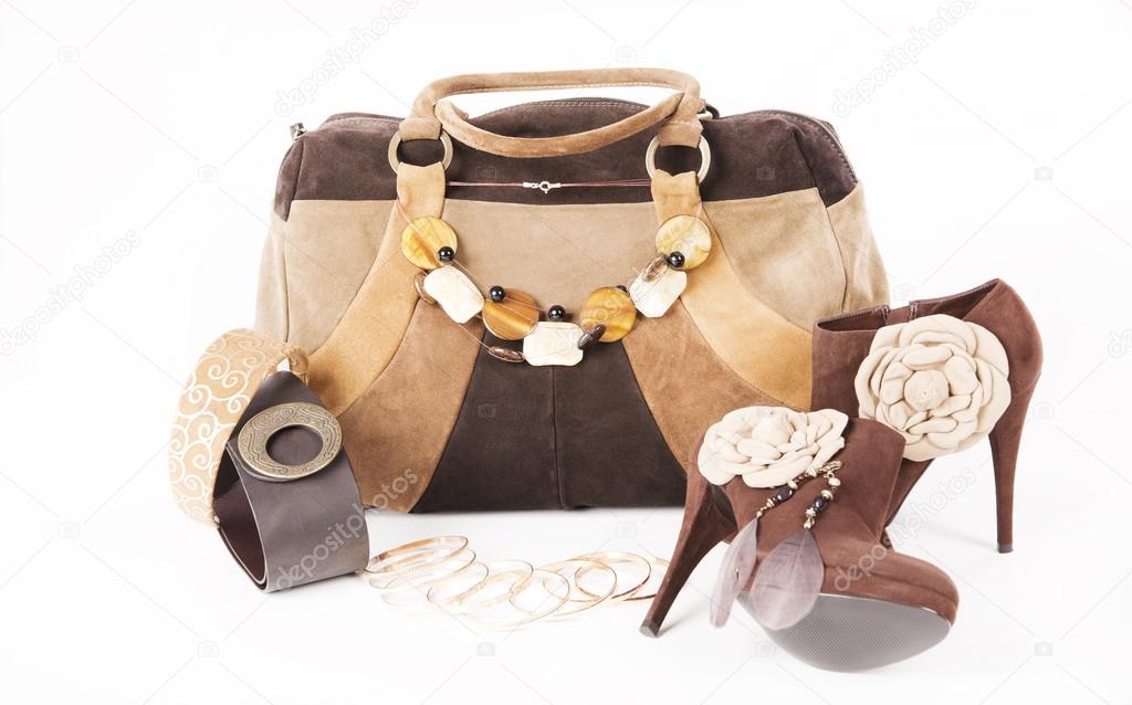 Female high-heeled boots and beautiful bag