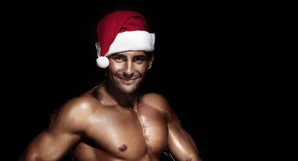 Portrait of a sexy smiling Santa Claus. — Stock Photo, Image