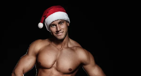 Retrato de homem bonito sorridente em chapéu de Papai Noel . — Fotografia de Stock