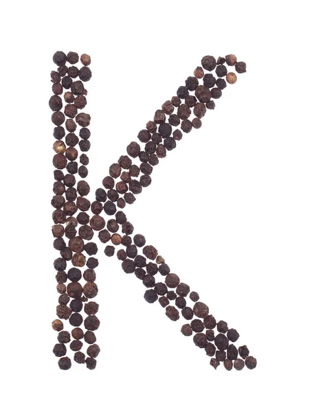 Letter K made of pepper — Stock Photo, Image