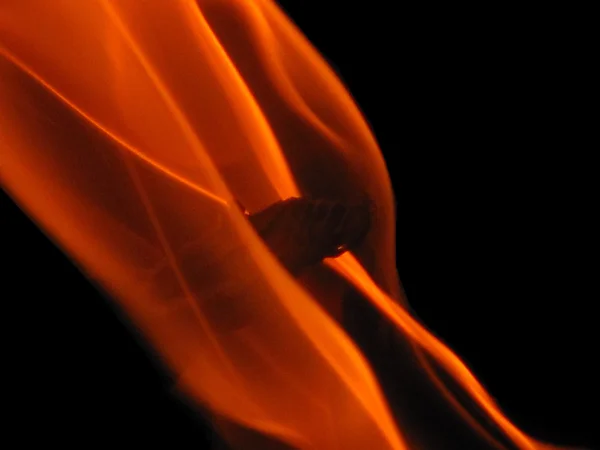 Orange flame isolated on black — Stock Photo, Image