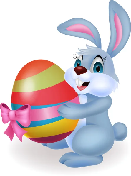 Desenhos animados de coelho bonito segurando ovo de Páscoa — Vetor de Stock